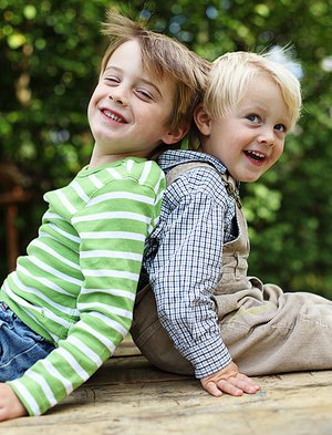 Whitney leaning against a railing on a downtown street